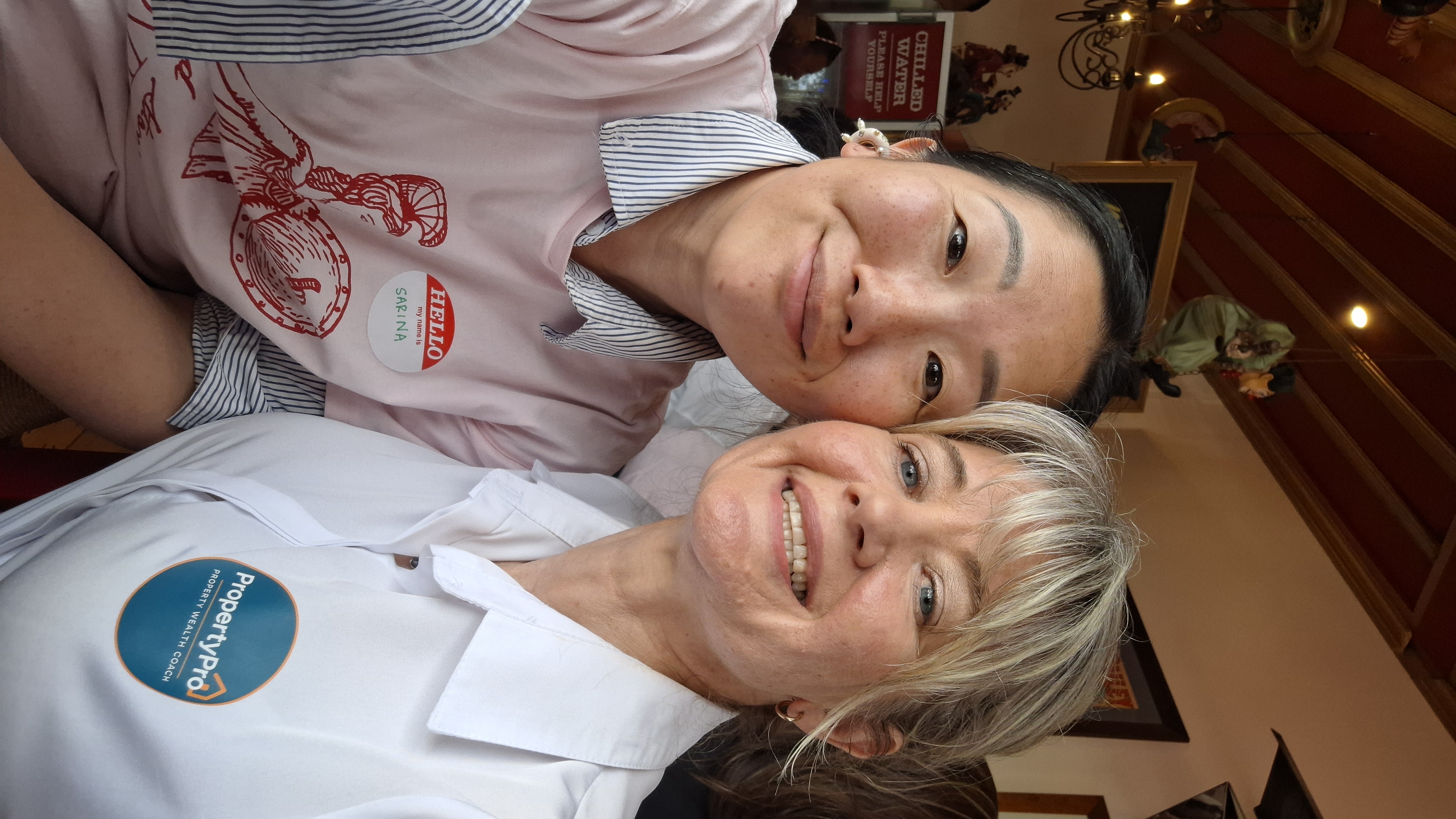 Speaker Sarina Gibbon and the host smiling together in a selfie