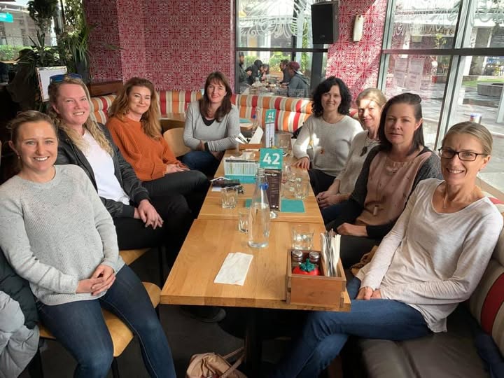 Women in Property members enjoying a meal together at a restaurant